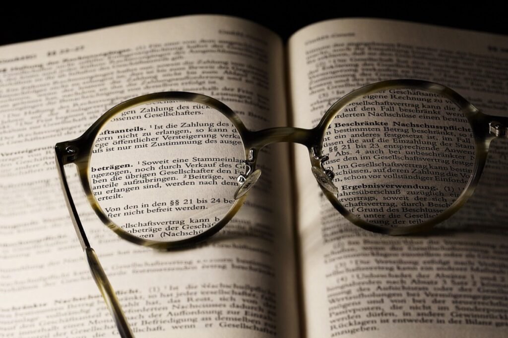 Reading glasses resting on an open book